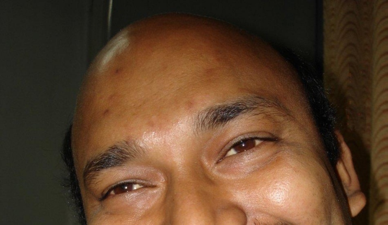 Fotografie zachycující mužskou tvář a smějící se oči