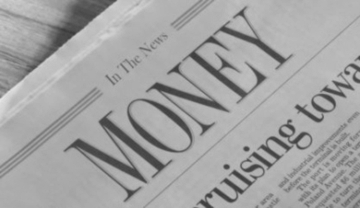 Fotografie novin s nápisem "Money"