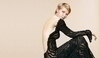 Kirsten Dunst v černých šatech s holými zády