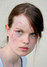 Fotografie ženy s poraněným obličejem